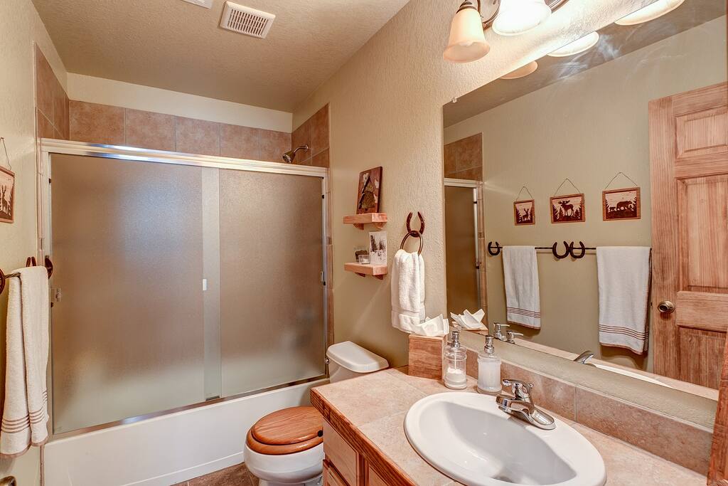 Fully stocked lower guest bathroom with tub/shower.