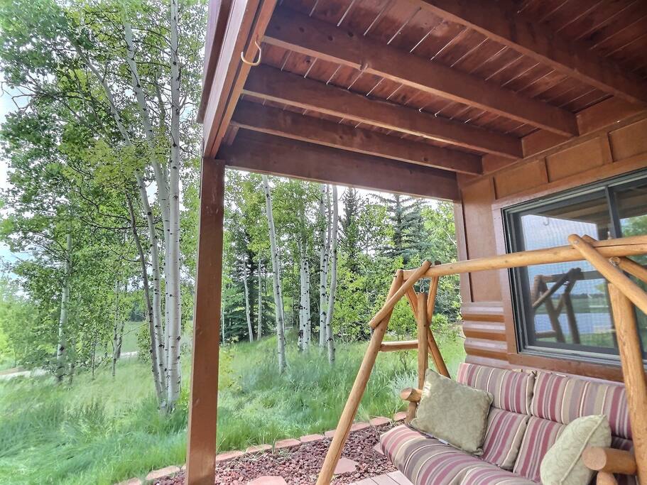 Swing on the patio overlooking the lake and aspen trees while you watch for moose to pass by.
