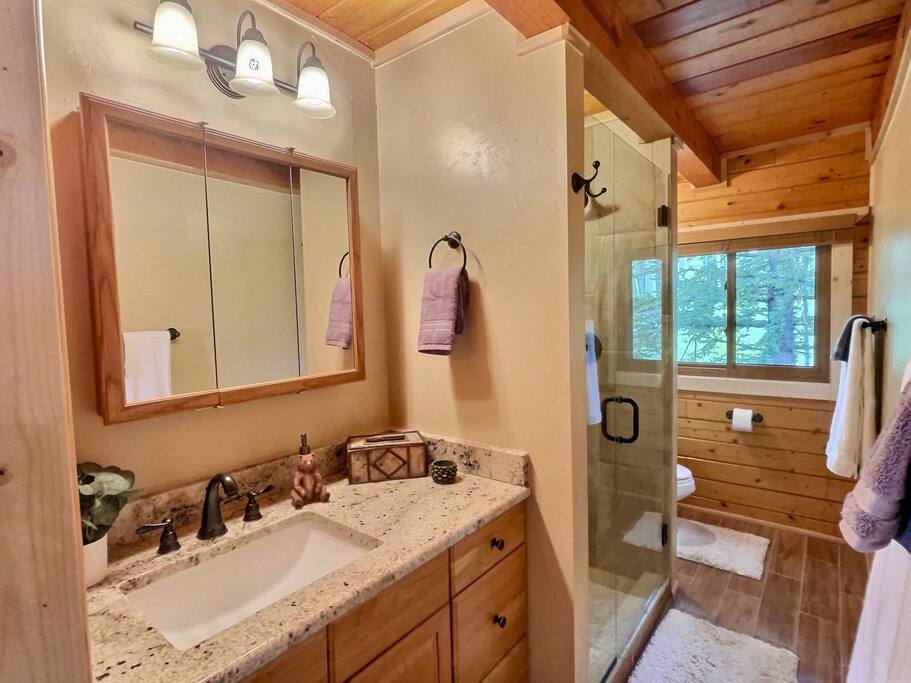 One of many full bathrooms, plush towels, wash cloths,  hand towels, shampoo/conditioner/body wash provided.