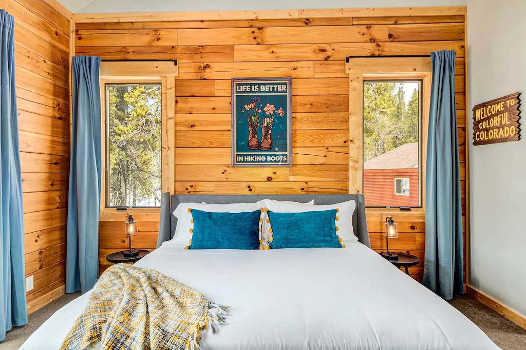 The SUMMER SUITE  - with ensuite this is the Master bedroom at Four Seasons Lodge - features a King sized upholstered bed with access to the south facing deck overlooking the meadow below.
