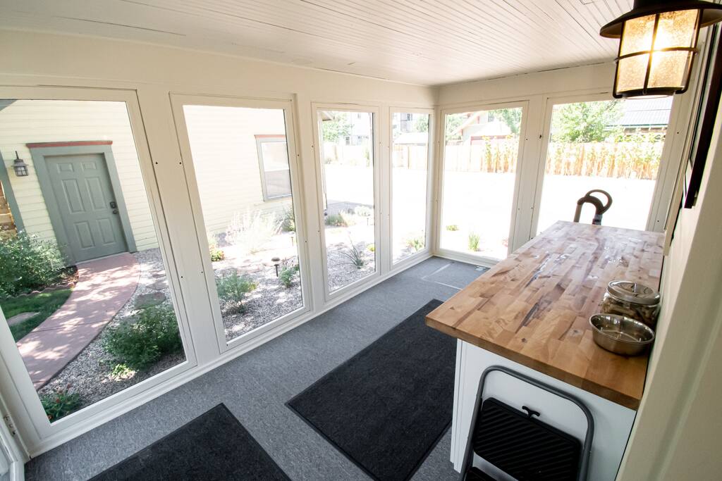 The sunroom, off the kitchen area, is a great place to store your extra luggage, outdoor gear etc.