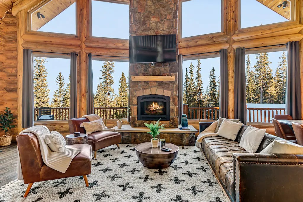 30 foot ceilings with massive timbers and windows throughout offer grand views at 11,000 ft.