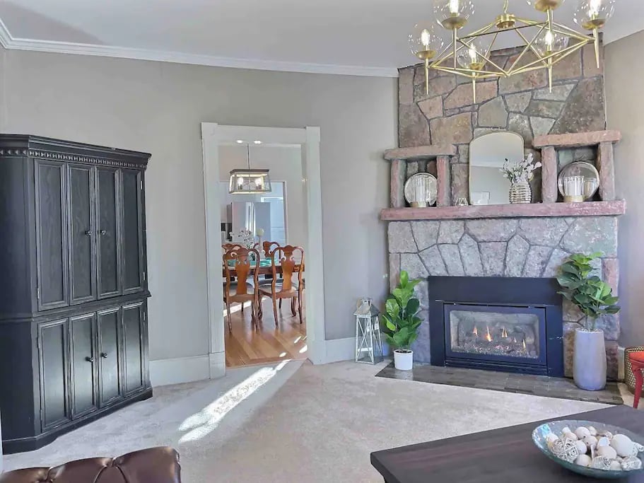 The gas log fireplace provides a cozy space to watch tv and visit with family and friends in the Grand Parlor.