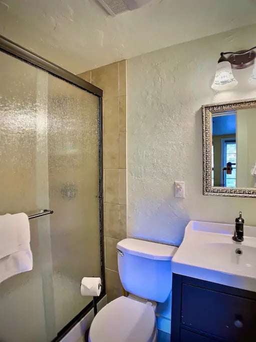 The Manitou suite's newly remodeled bathroom has a spacious tiled walk-in shower.