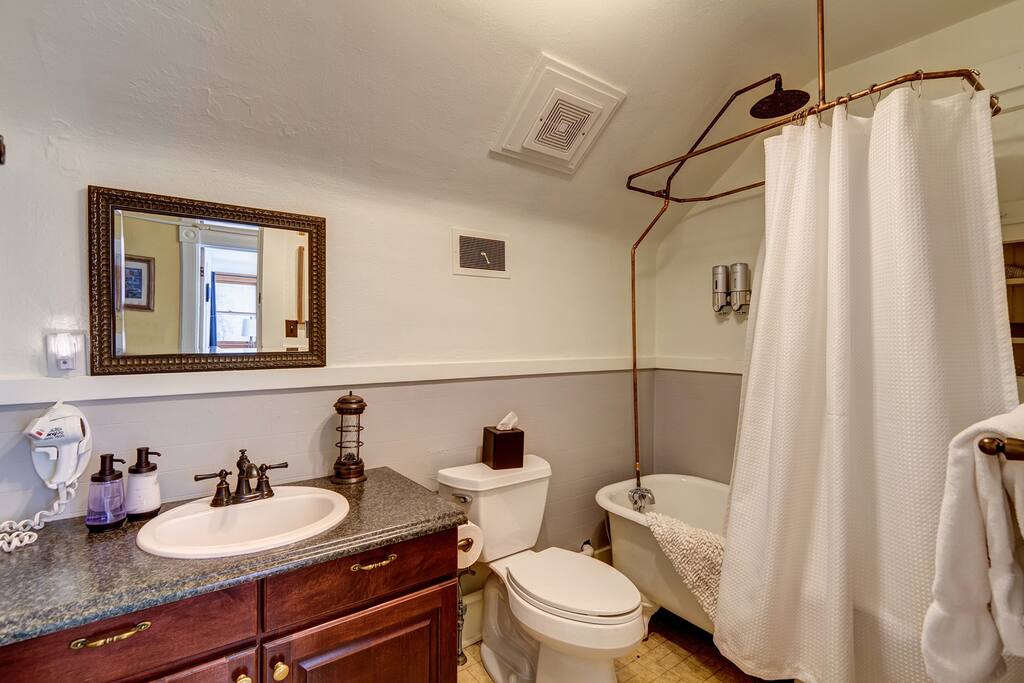 The bathroom designated for the Pawnee room features one of several clawfoot tubs found in the home.