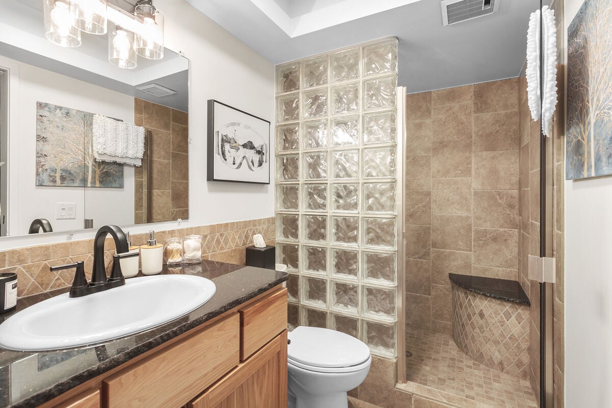 The Master Ensuite w/ Shower.  Fully stocked with everything you will need for a comfortable stay. Unlimited body wash, shampoo, conditioner, lotion, TP, quips, cotton swabs, and much more!