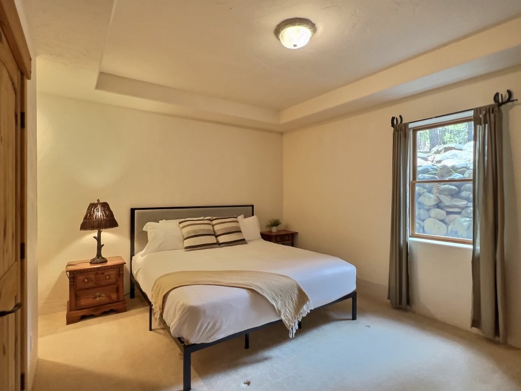 Lower King bedroom offers natural light, plus a walk in closet.
