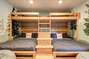Two Queen beds with twin beds on top! These custom bunk beds are perfect for families with children or make it a big kids room