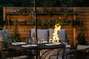 The fire pit creates stunning ambience for an evening meal outside.