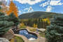 Majestic views from the private multi-tiered patios surrounding the waterfall into the 12 person grotto spa.