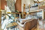 Open kitchen/living/dining concept with loft overhead