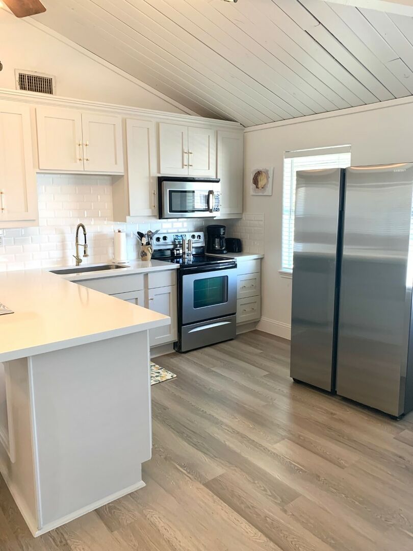 For the nights you decide to dine in, this light and bright kitchen with full size appliances is ready for your use.