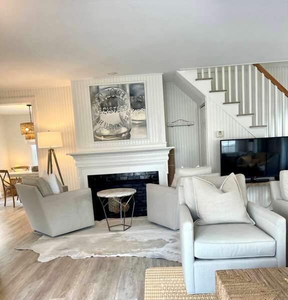 Two cozy swivel chairs near the fireplace for those Fall evenings - 5 Zylpha Road Harwich Port Cape Cod - The Sandbox - NEVR