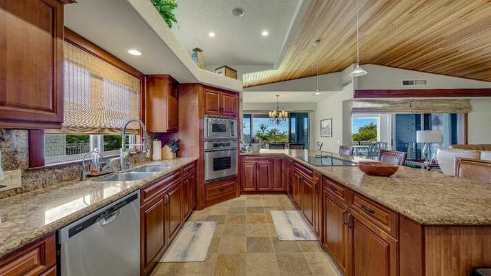 The gourmet kitchen is finished with granite countertops and top of the line appliances