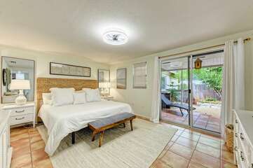 This master King bedroom has easy access to the backyard.