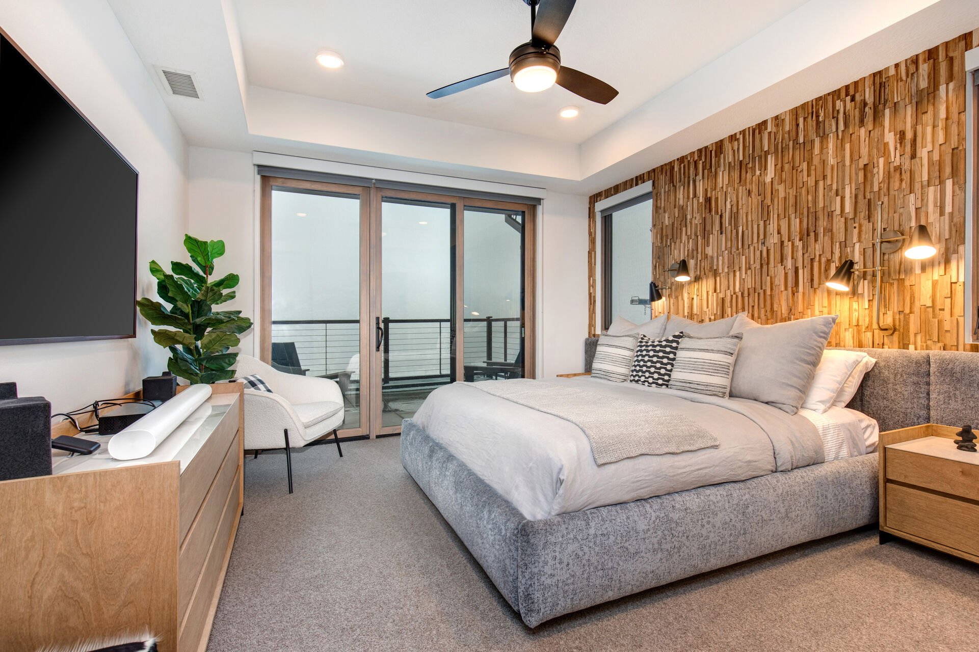 Master Bedroom 1 with king bed, smart tv, private balcony, and en suite bathroom