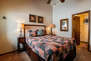 Master Bedroom with queen bed, flatscreen tv, private access and en suite bathroom
