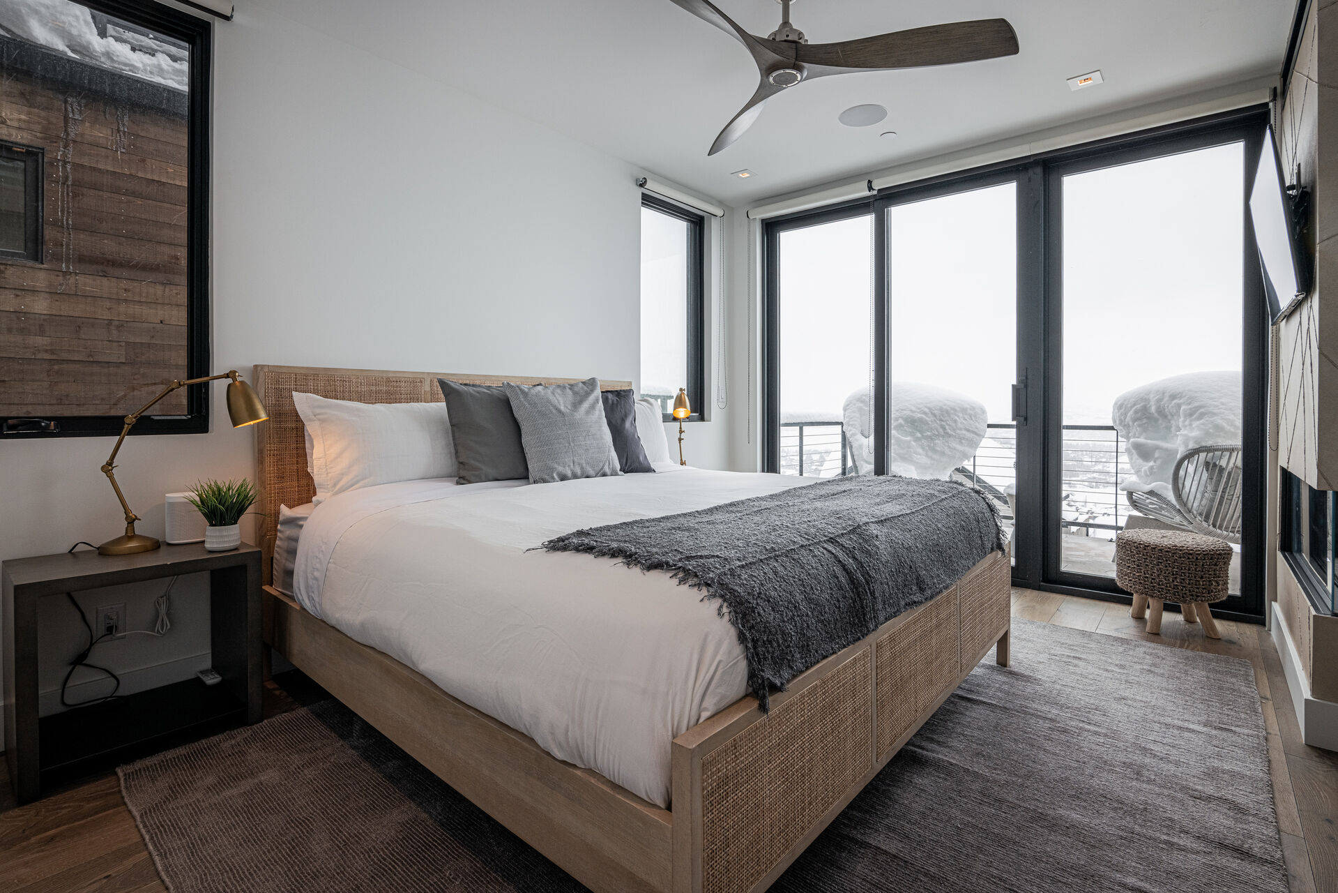 Master Bedroom 1 (third level) — King size bed, Smart TV, gas fireplace, private patio, and en suite bathroom