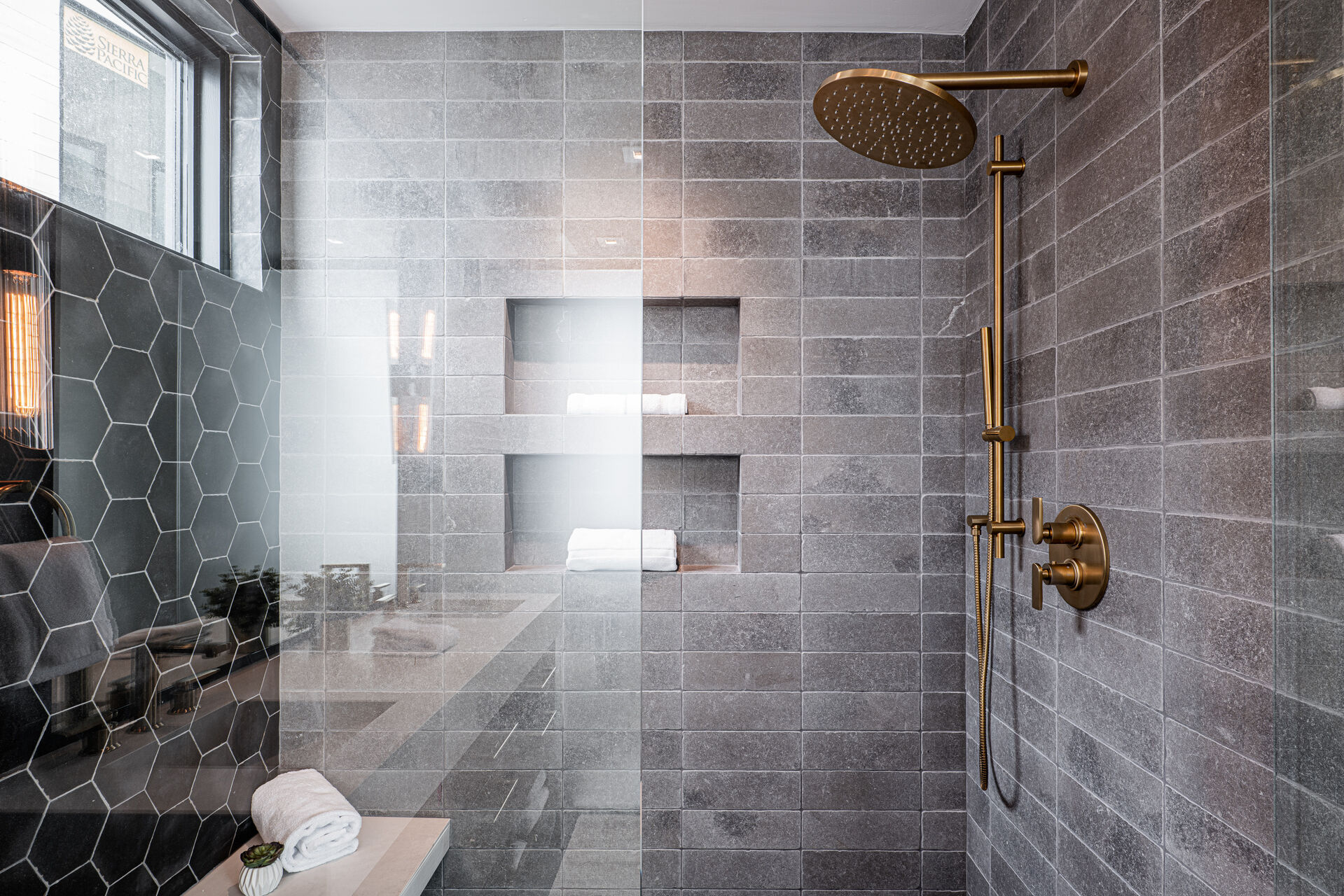 Master Bathroom 1 with dual stone counter sinks, large tile and glass (steam) shower