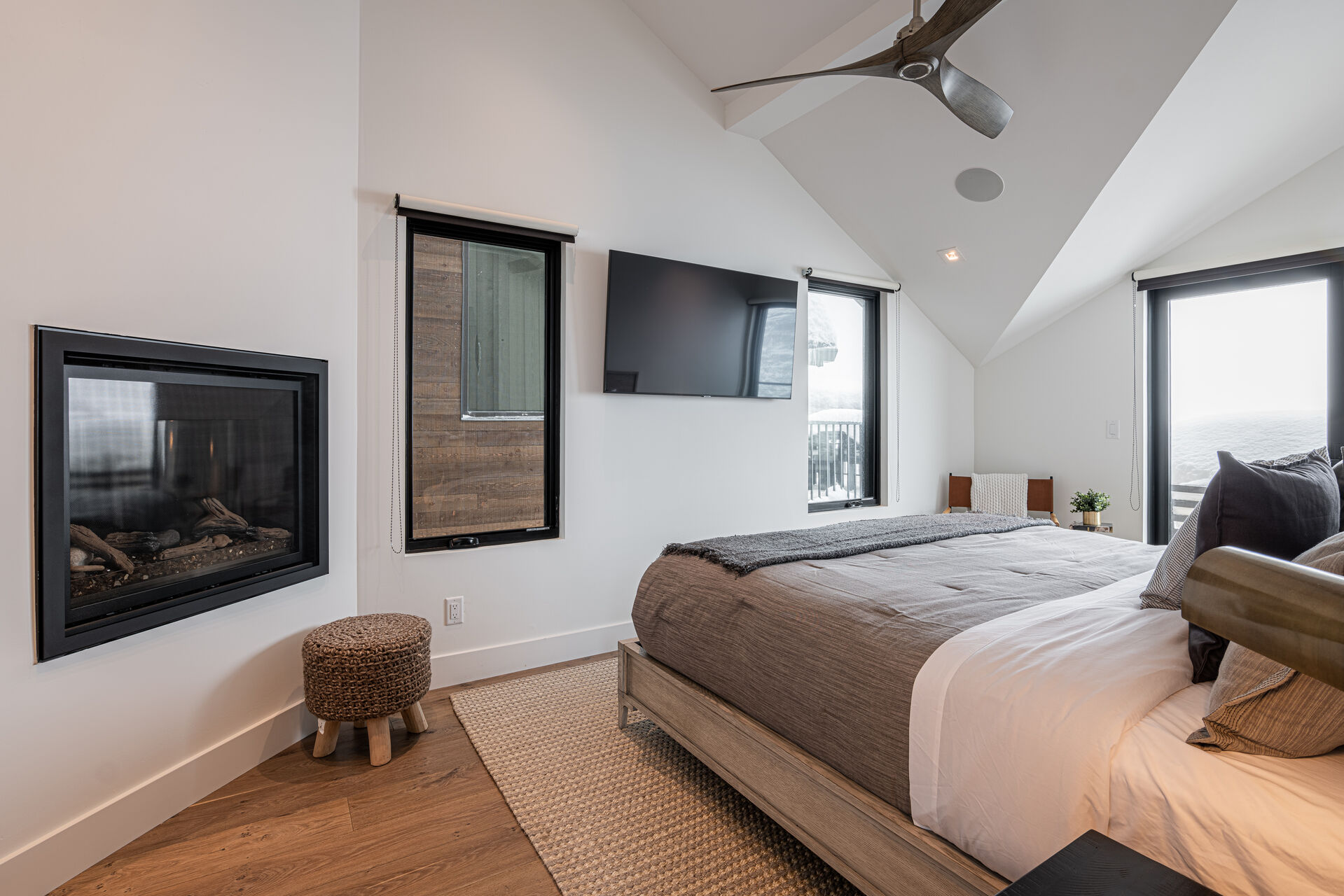 Master Bedroom 2 (fourth level) – King bed, Smart TV, gas fireplace, large walk-in, and en-suite bathroom