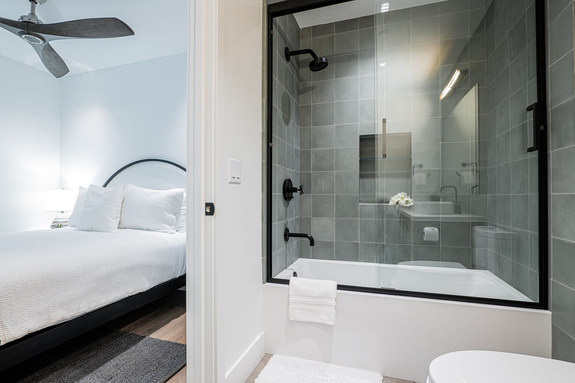 Bedroom 3 (third level) – Queen size bed, and the en-suite bathroom offers a glass and tile shower