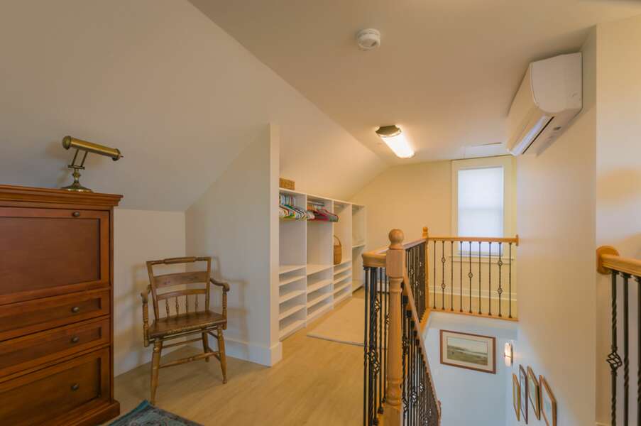 Upper Level Primary Suite with full bathroom, bedroom, large closet and laundry area.
