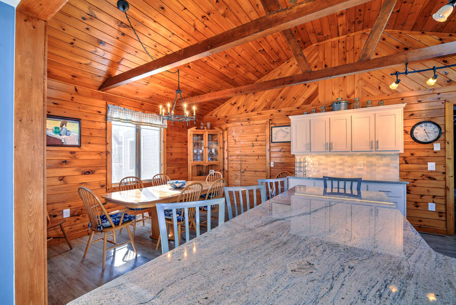 Beautiful family friendly kitchen island that seats 6 guests and dining room table that seats 6 guests.