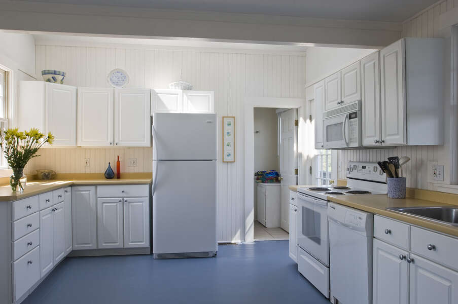 White fully equipped kitchen.