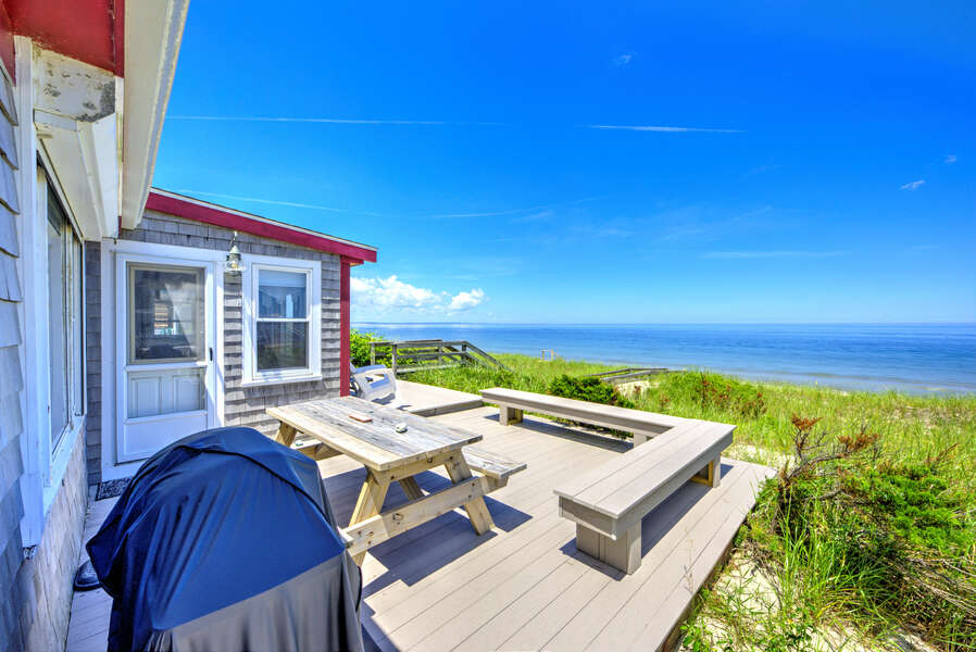 Welcome to 87 North Shore Boulevard, East Sandwich! 

Back deck on East Sandwich Beach with seating and grill.