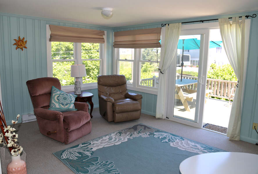 Living room area with a slider to the deck.