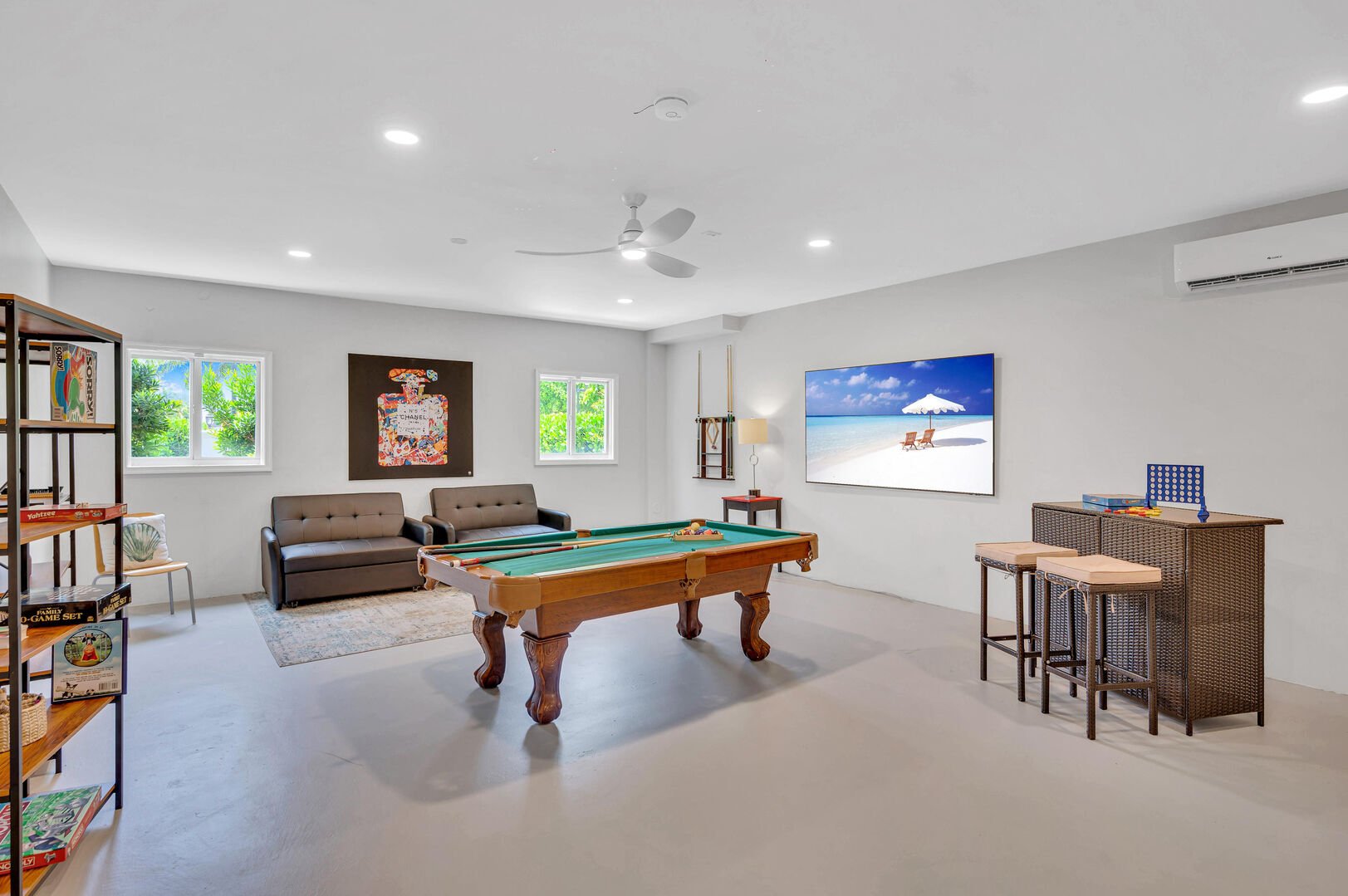 The game room features a pool table, 85' Smart TV, boardgames