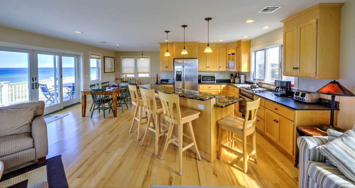 Fully equipped kitchen with island and plenty of seating for the family.