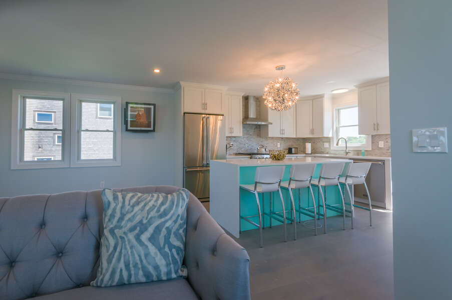 Open concept kitchen into the living room for family gatherings.