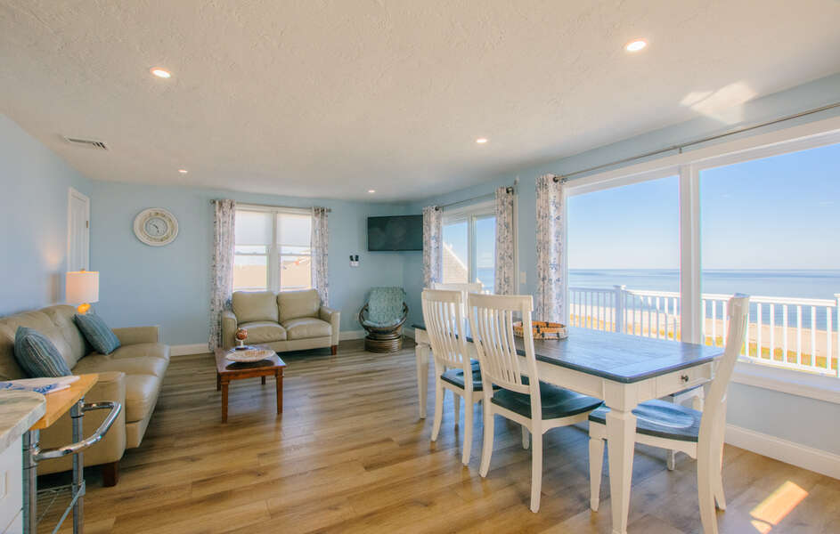 Open concept living room/dining area and beautiful views of the ocean.