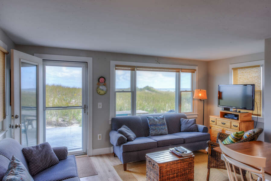 Living room area with views of East Sandwich Beach.
