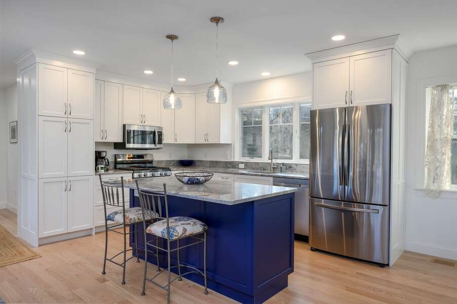 Stainless steel and hues of blue adorn this kitchen - 85 Cockle Drive South Chatham Cape Cod - Ides of Marsh - New England Vacation Rentals