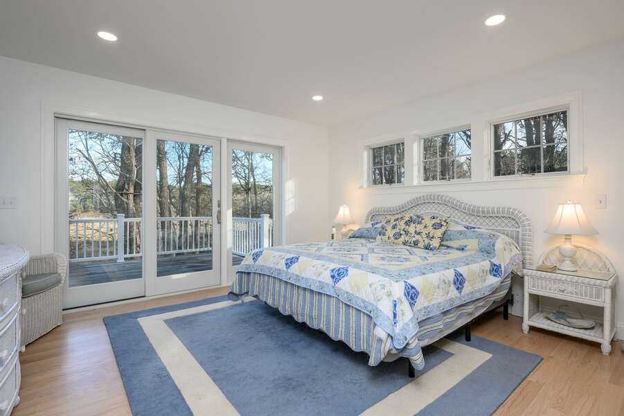 Wake up to calming views from the King-sized bed in the Primary bedroom - 85 Cockle Drive South Chatham Cape Cod - Ides of Marsh - New England Vacation Rentals