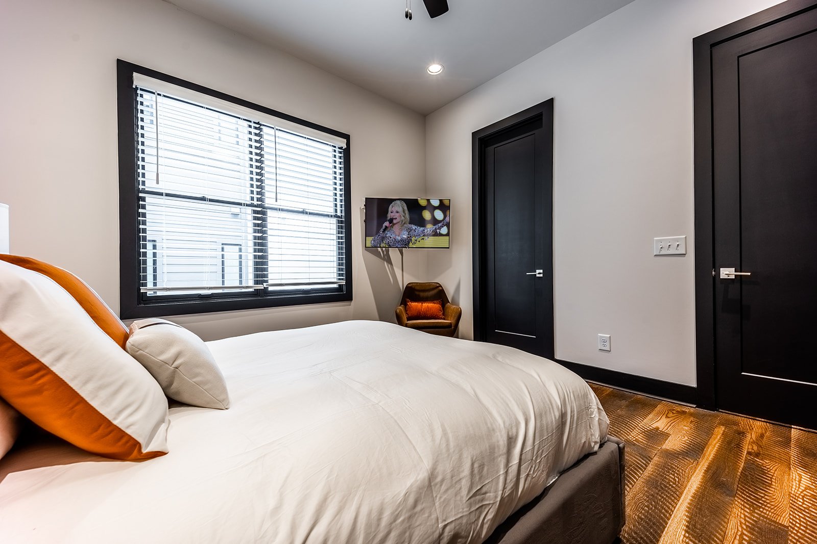 1st unit: 3rd bedroom with Queen bed, smart TV, private desk area, and en-suite bathroom.