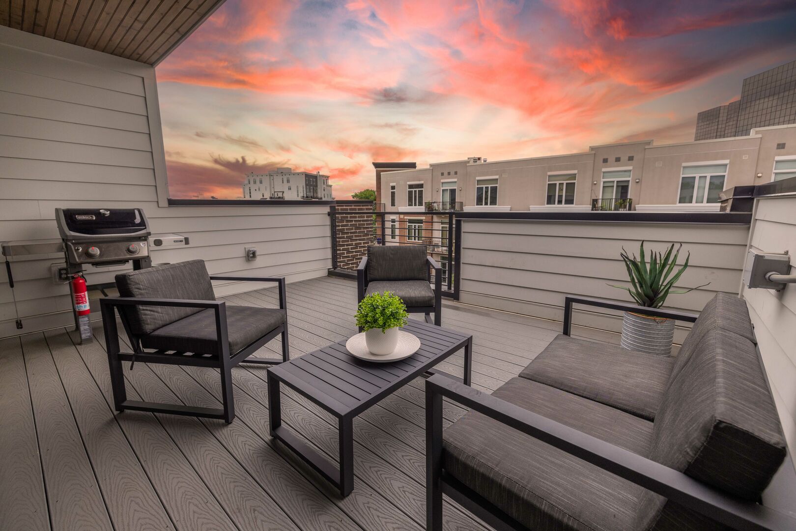 (1st Unit): Private rooftop patio with BBQ grill, lounge area, and incredible views of downtown.