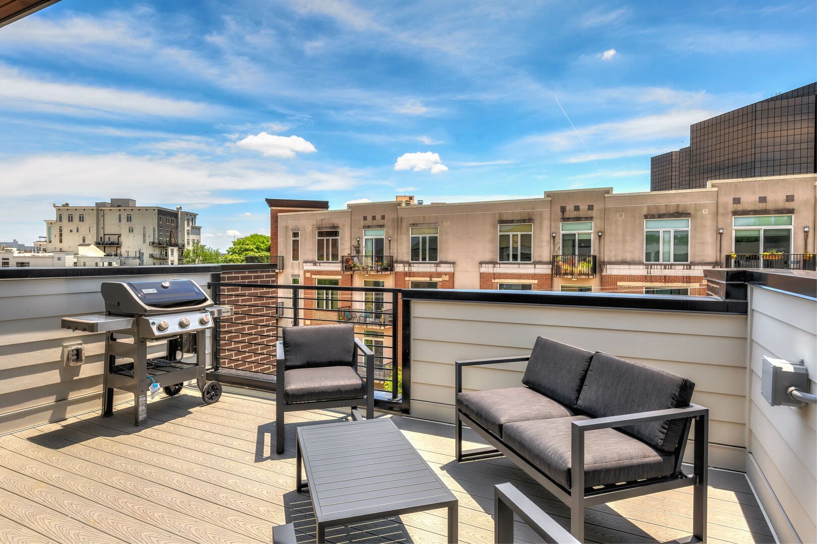 (1st Unit): Private rooftop patio with BBQ grill, lounge area, and incredible views of downtown.