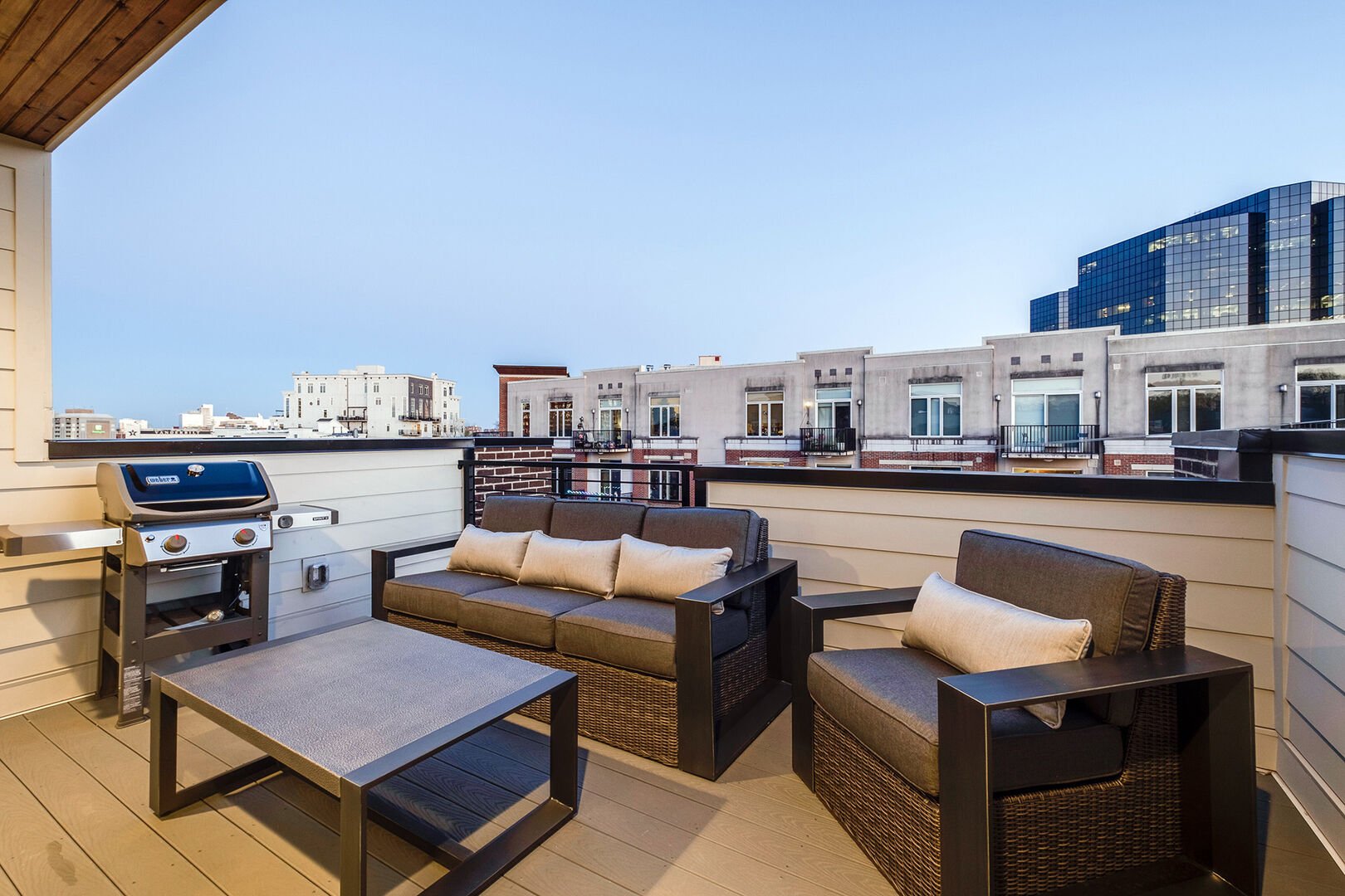 Private top floor deck with multiple seating and BBQ grill