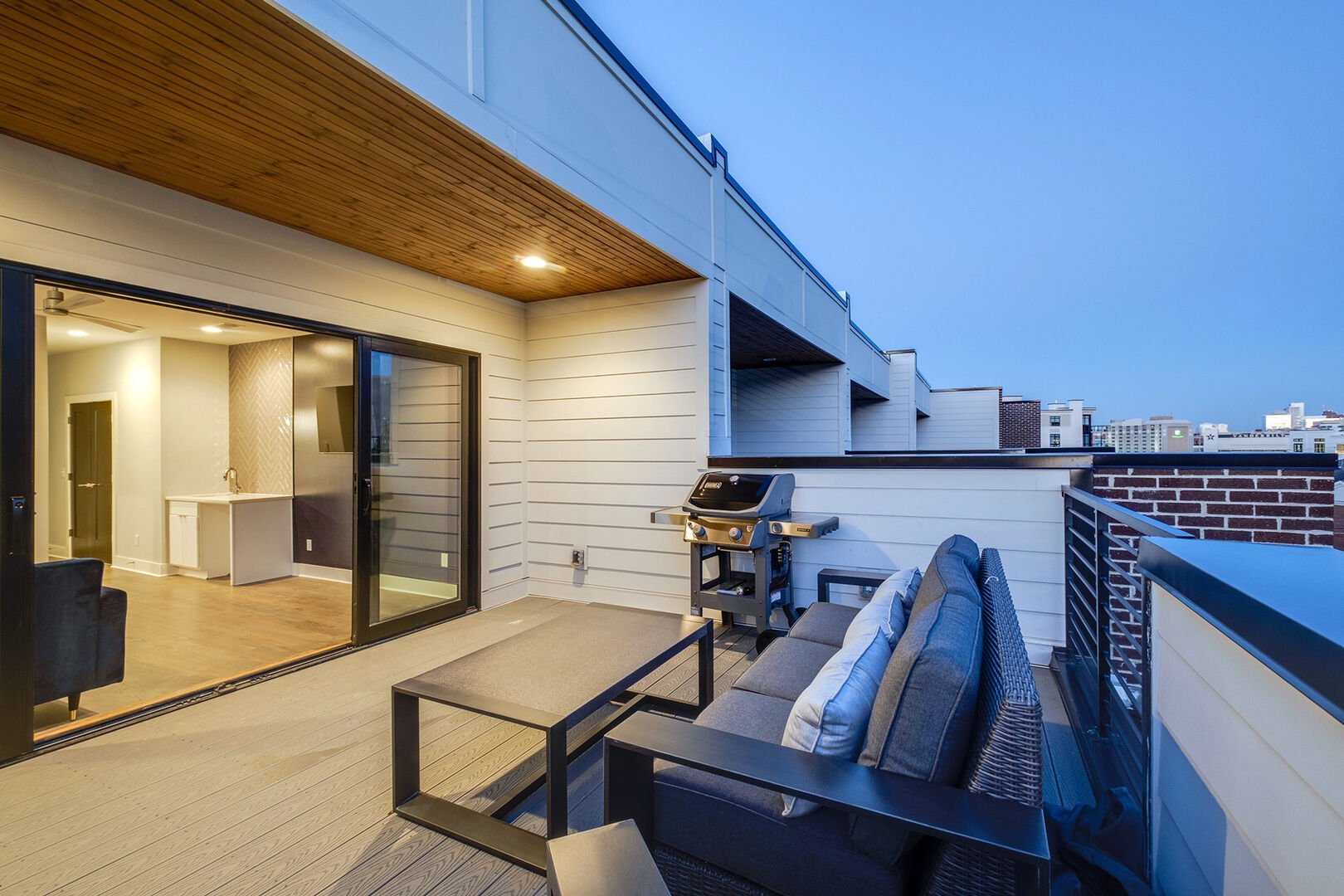 Private top floor deck with multiple seating and BBQ grill