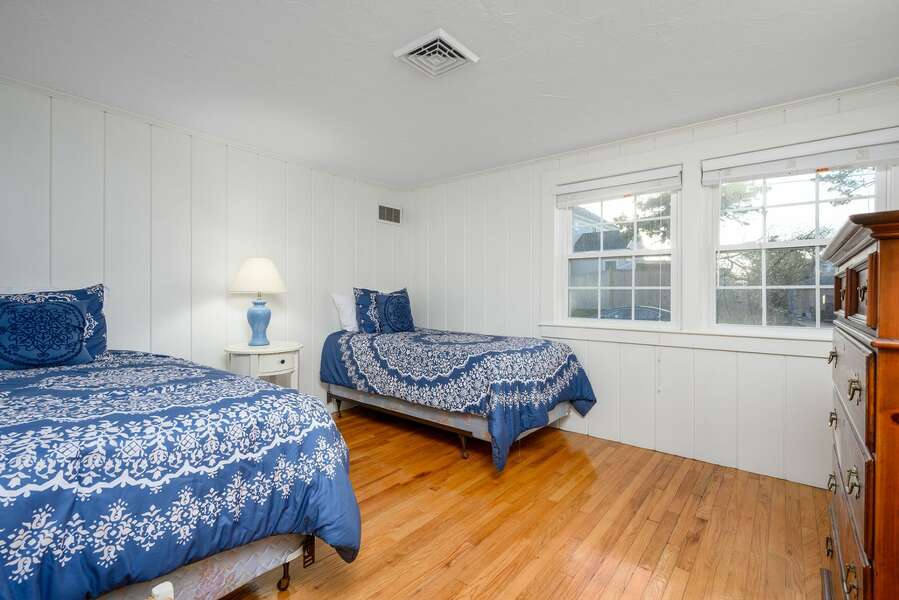 Fun bright blue featured in this bedroom with two Twin beds - 3 Shore Road Extension West Harwich Cape Cod - A Shore Thing - New England Vacation Rentals
