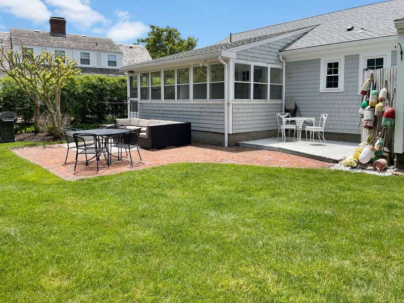 Patio, deck area with gas grill and lots of lawn space to enjoy in the back of the house - 3 Shore Road Extension West Harwich Cape Cod - A Shore Thing - New England Vacation Rentals