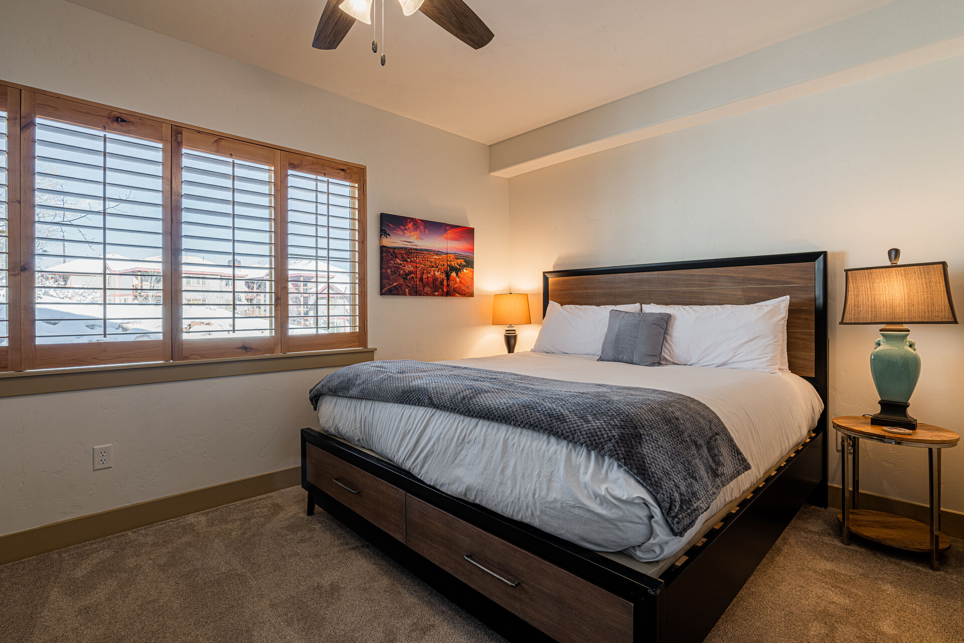 Master Bedroom with King size bed, TV, and private bathroom