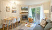Dining area for four, wood burning fire place (wood provided) and a full size sleeper sofa