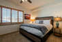 Master Bedroom with King size bed, TV, and private bathroom