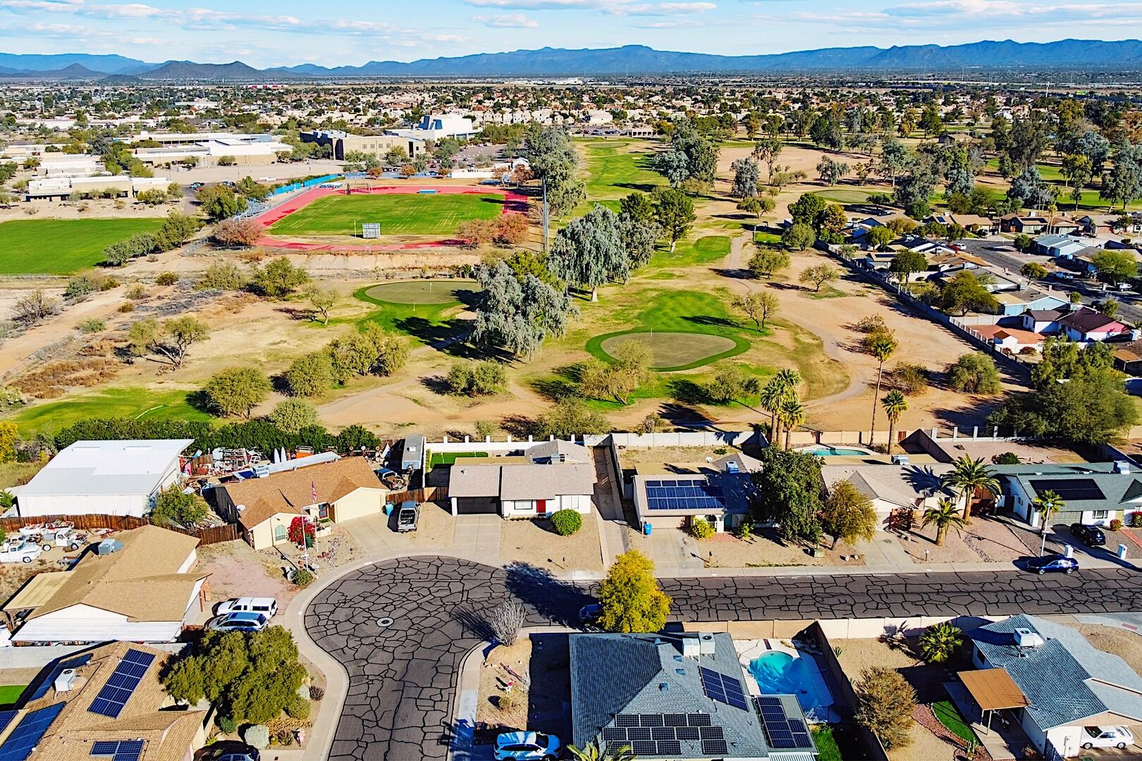 Aerial of golf course & city views