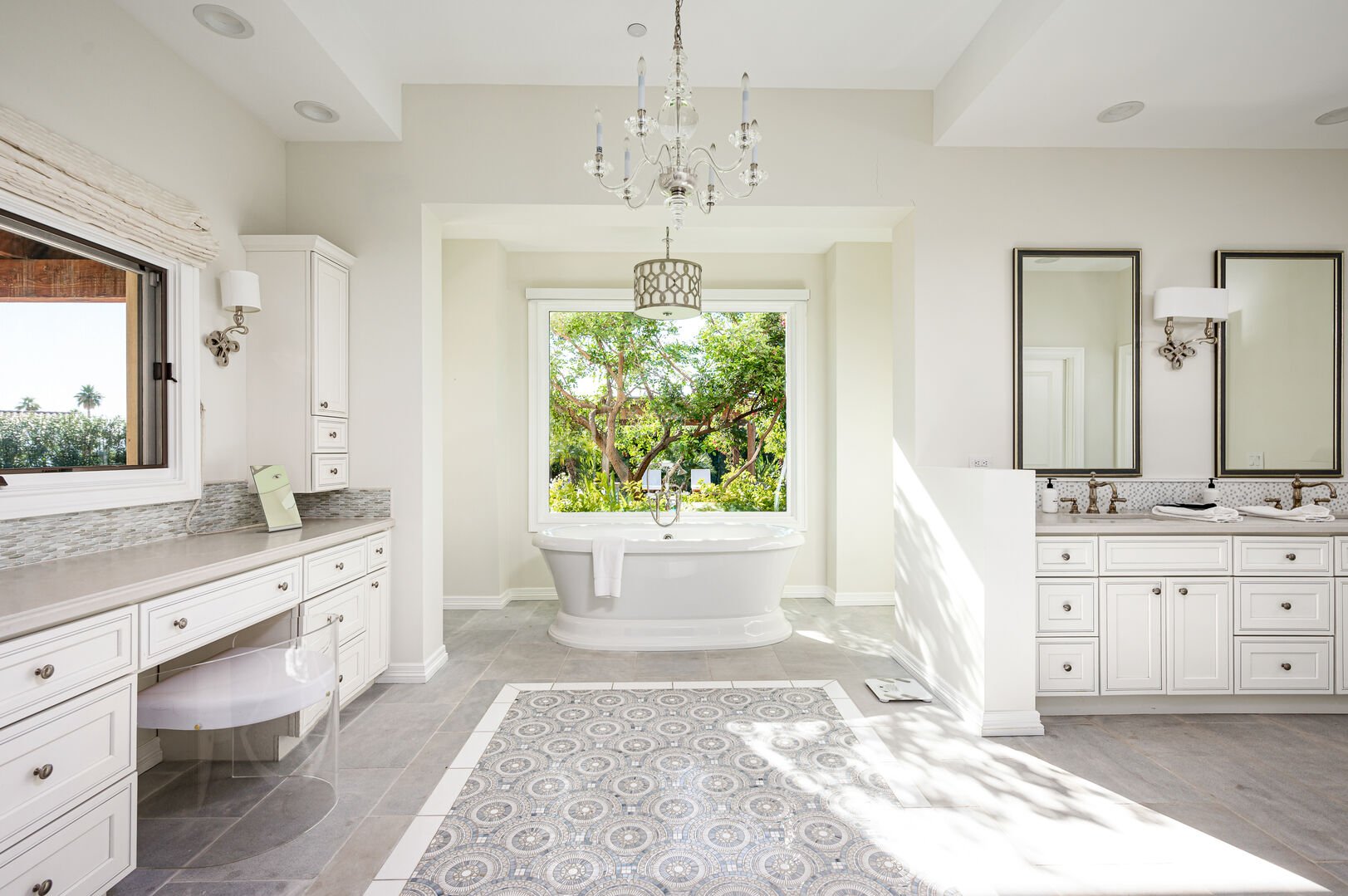 Master bathroom fit for royalty. There is a vanity space to prepare for the day and a large soaking tub.