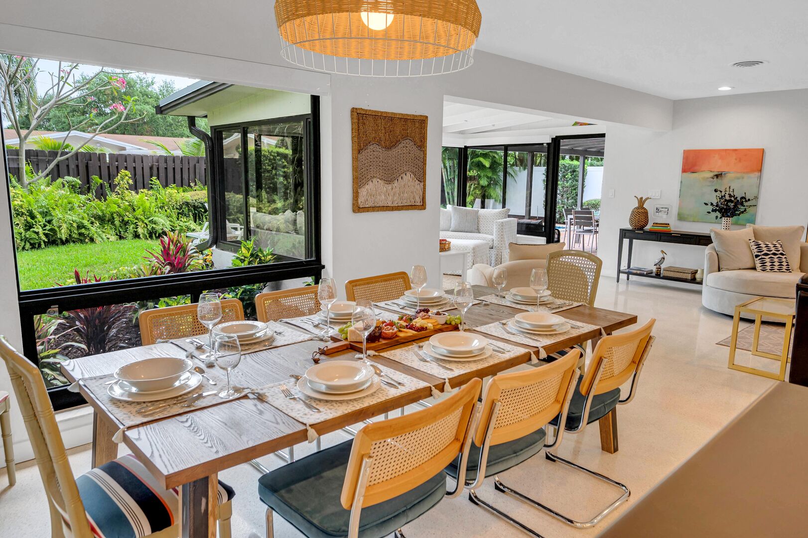 The dining area adjacent to the kitchen is fit for eight and overlooks the lush garden.